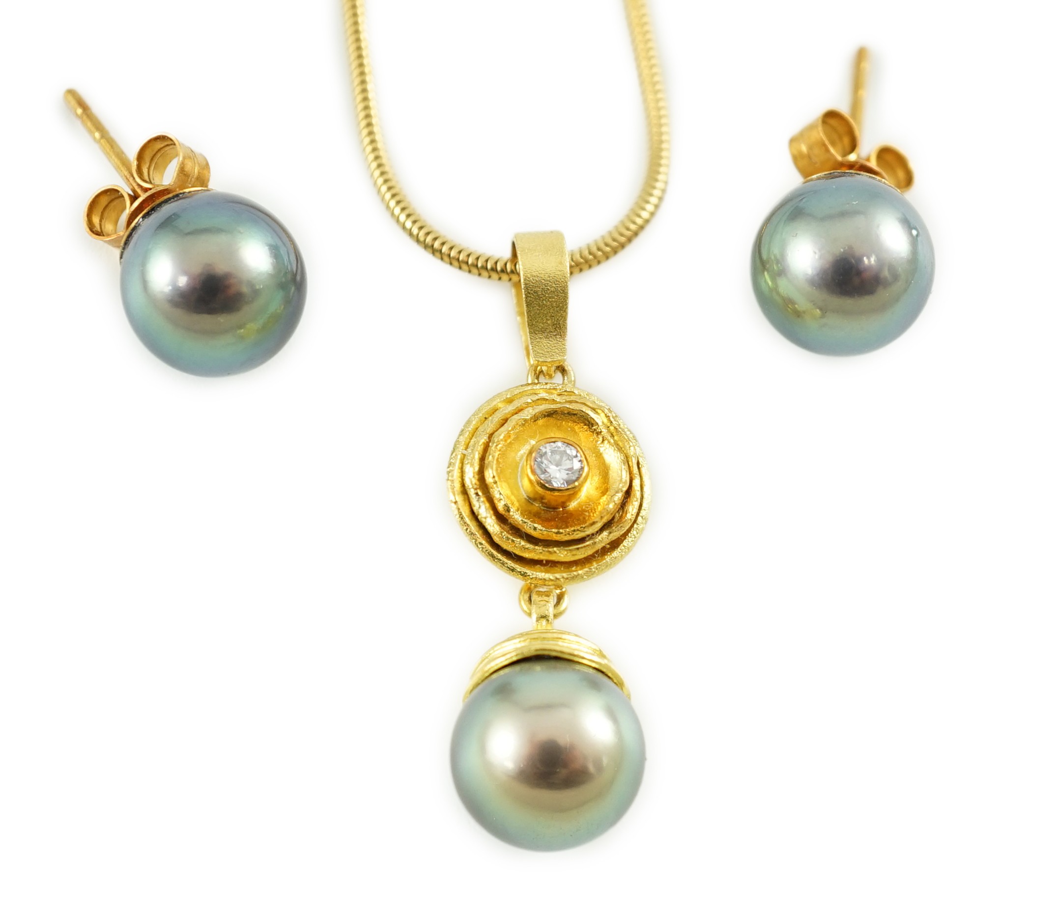 A modern textured gold, diamond and Tahitian pearl set drop pendant, on an 18ct gold snake link chain, in Asprey & Garrard box and a pair of 18ct gold and Tahitian pearl earrings, in Asprey & Garrard box